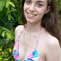 Skinny teen Tali Dova extracts her small boobs from swimsuit