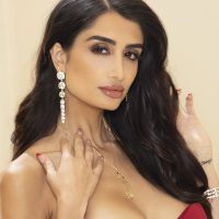 Centerfold model Mia Ventura slips out of a  gown to go nude in heels
